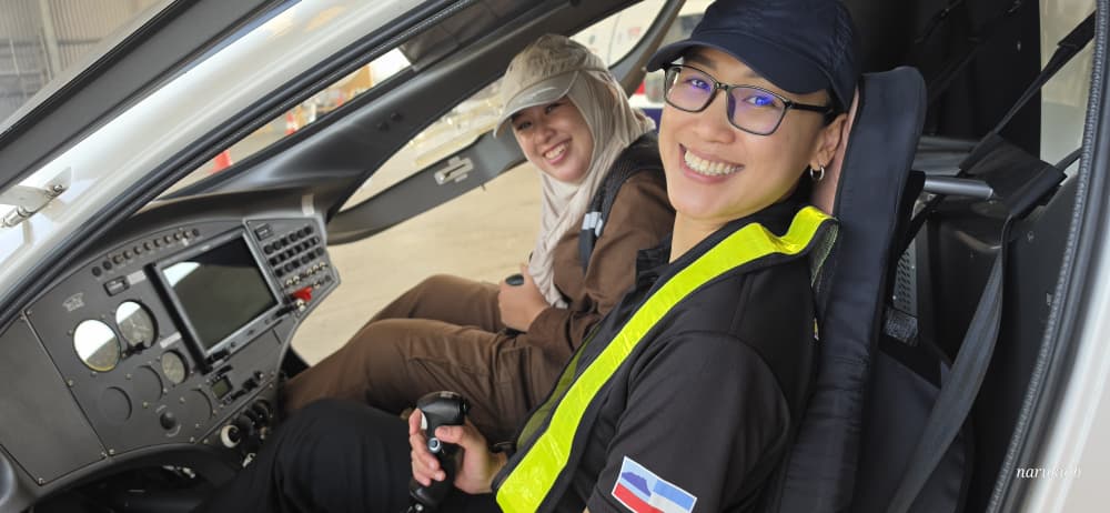 NK Robotics team members in an aircraft cockpit